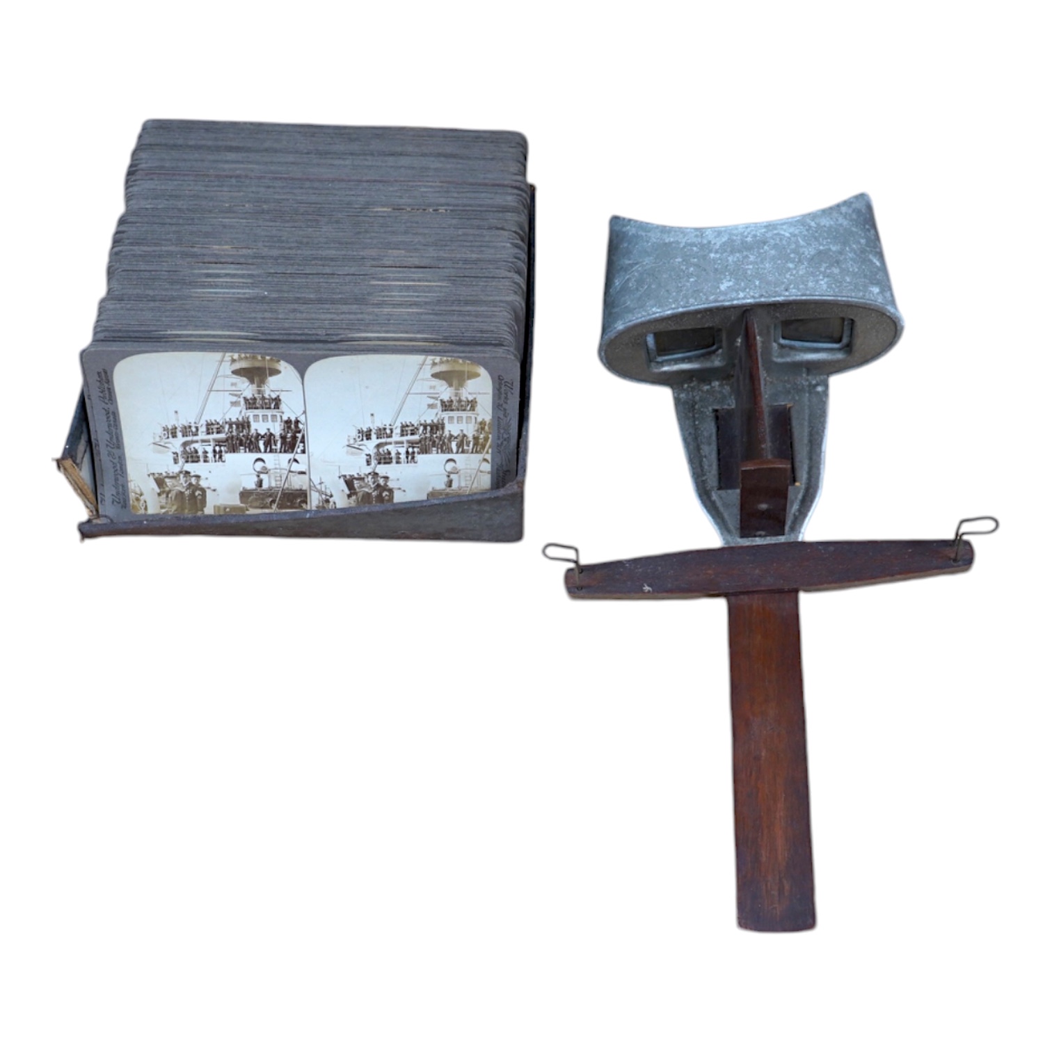 A hand held stereoscopic viewer with a selection of cards of Japanese scenes. Condition - fair.